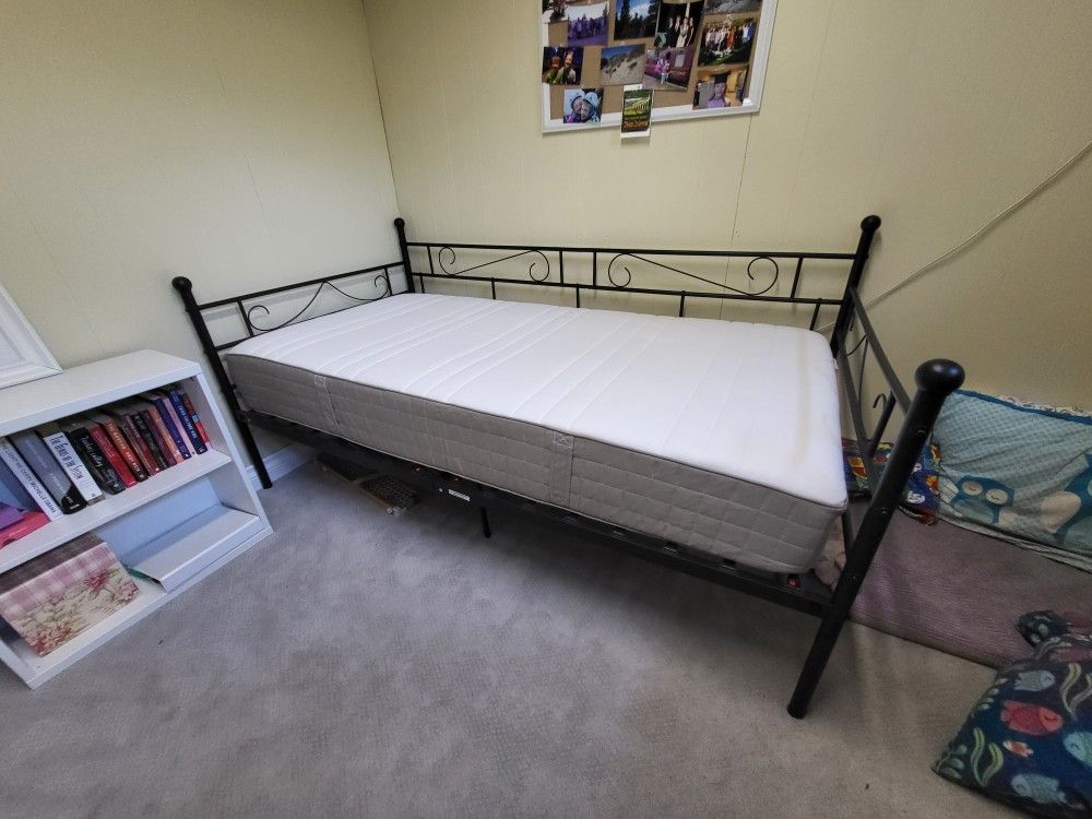 Metal day bed frame with single mattress