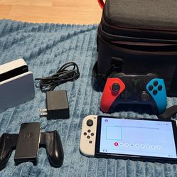 Nintendo switch oled with docking station, controller, charger and case no trades cash only. Check my page for other gaming stuff.