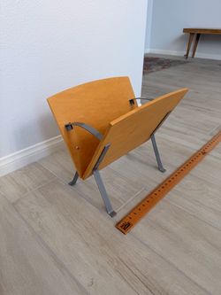 Vintage Postmodern v-Shaped Magazine Rack 16ʺW × 12ʺD × 14.5ʺH Made of metal with either maple or birch wood. Most likely from the 80s or 90s West Las