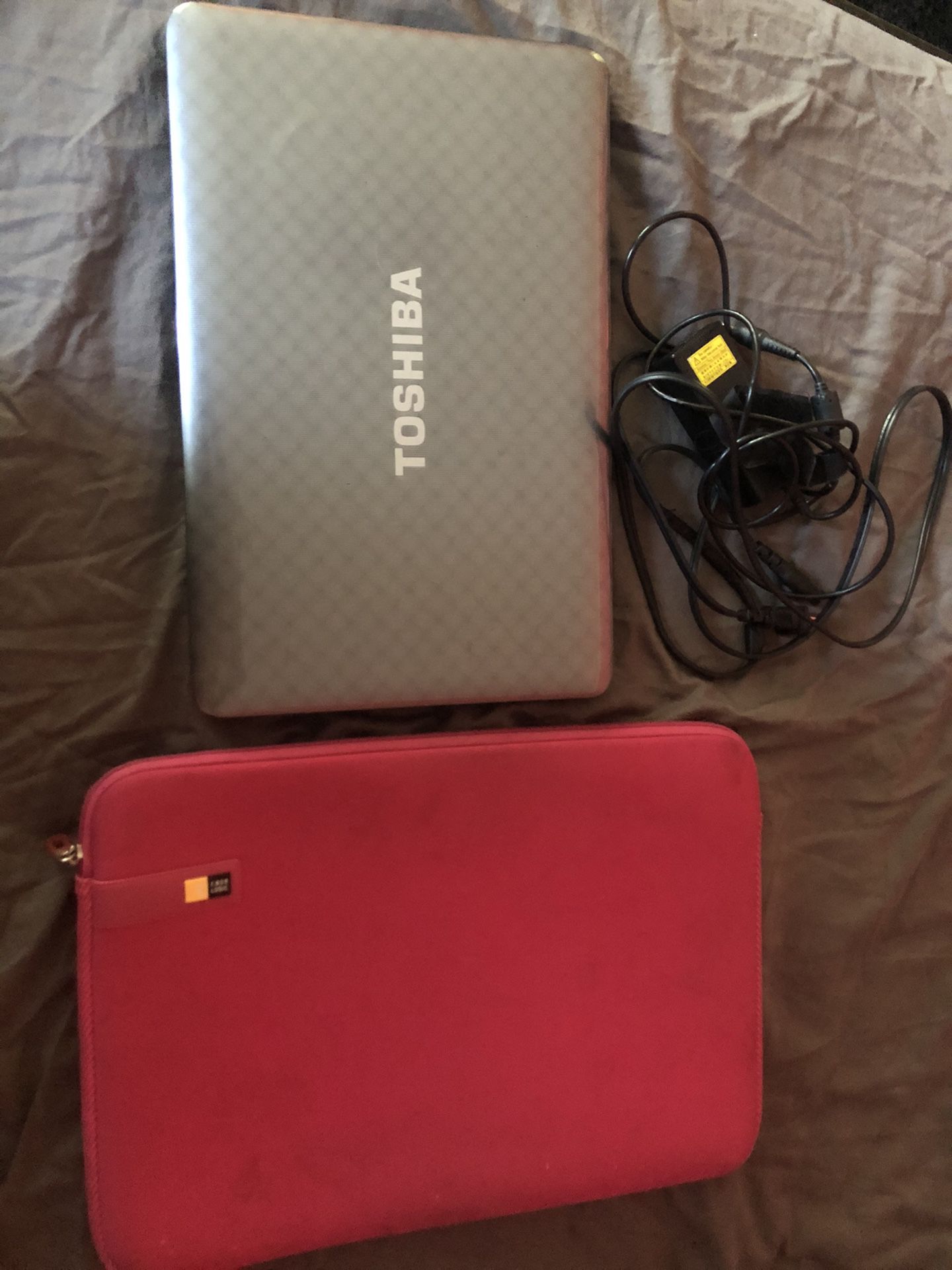 Toshiba 14” laptop with a case and charger, not used much because I got a new one.