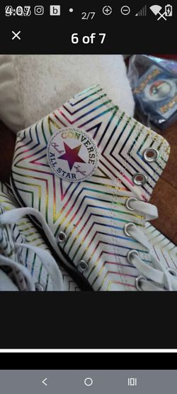 This is a Converse Chuck Taylor All Star High Metallic Exploding Star sneaker in white sz-10