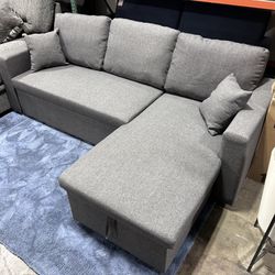 Section With Pull Out Bed And Storage 