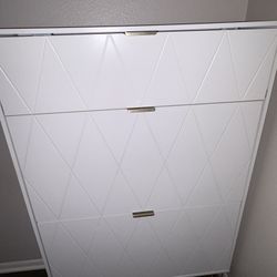 Elegant white shoe cabinet with gold accents