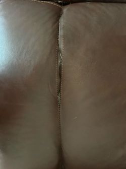 Brown leather couch and loveseat