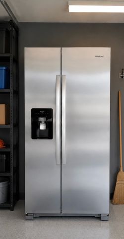 Whirlpool Side-by-Side refrigerator with an external water and ice dispenser.