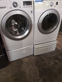 LG front load washer and dryer set with pedestals in excellent conditions