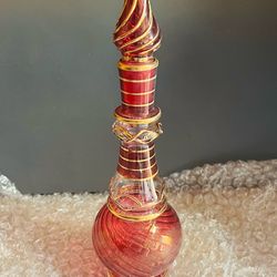 Set of 3 glass genie bottles, each approx. 8 inches tall. Great for home décor, centerpieces, or collectors of vintage-style glass.