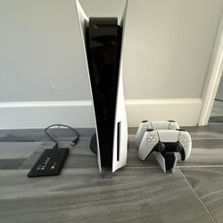 PS5 with 2 controllers, charging dock and 2tb extended storage