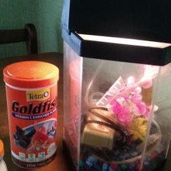 Fish tank, bubbler,light on tank and fish food 15$