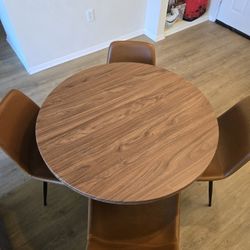 Circular Wooden Dining Table with 4 Brown Faux Leather Chairs