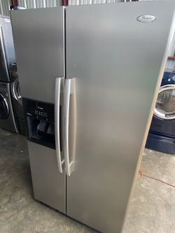 Great Whirlpool refrigerator side by side  with ice maker and water dispenser