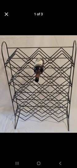 Metal freestanding wine rack holds 20 wine bottles