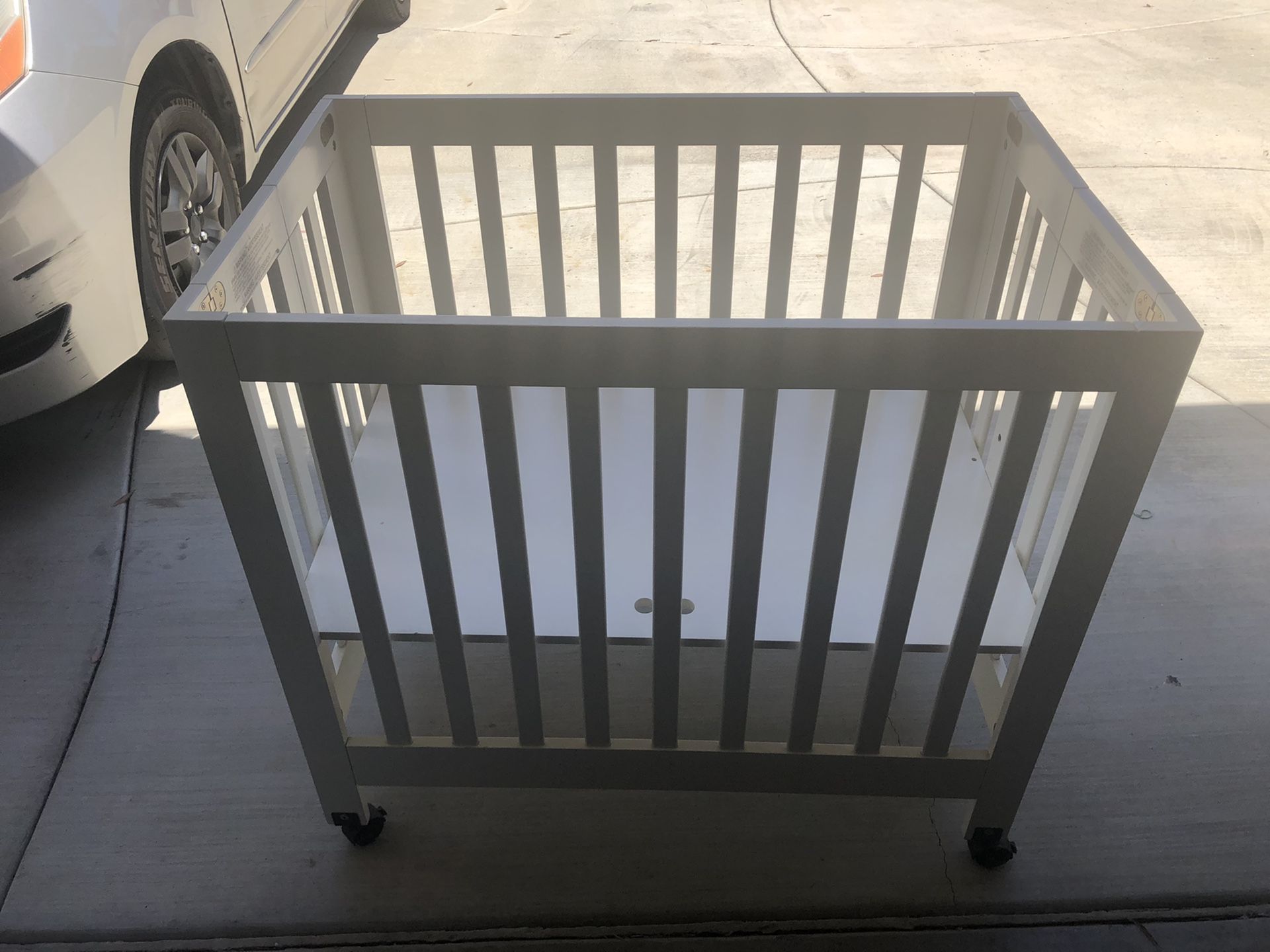 Babyletto Portable Mini Crib and lightly used Babyletto mattress