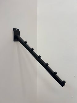 Clothes wall hanger holder