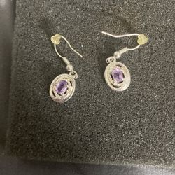 They are amethyst and sterling silver dangle earrings.