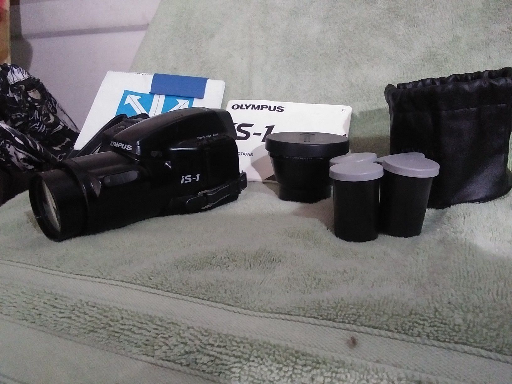 Olympus i.s. 1 camera, zoom lens, 3 films in case and bag