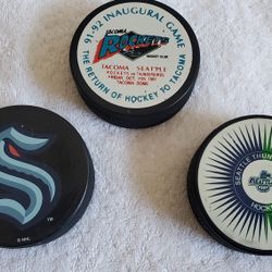 3 seattle team hockey pucks krackens, rockets and thunderbirds inaugural all for price