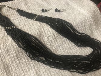 Black multi strand bead necklace and matching earrings