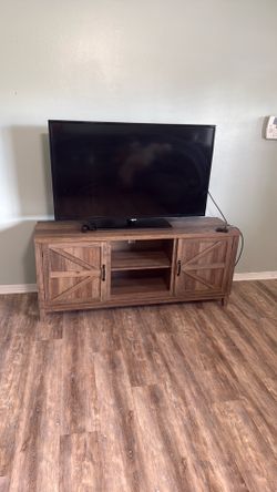 TV stand with TV included
