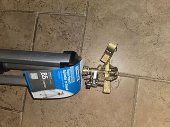 Brand new sprinkler on tripod