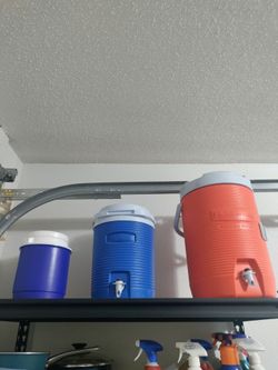 Table grill, ice chest, and containers for water
