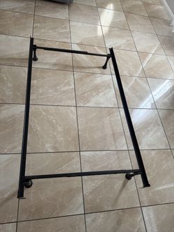 Adjustable twin or full size metal bed frame