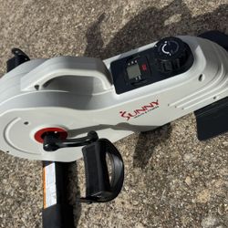 Sunny Health & Fitness under-desk pedal exerciser.