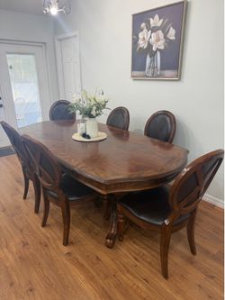 Dinning table with 8 chairs (real wood)