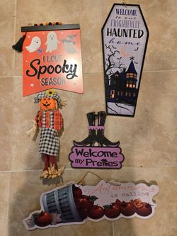4 fall signs and a scarecrow
