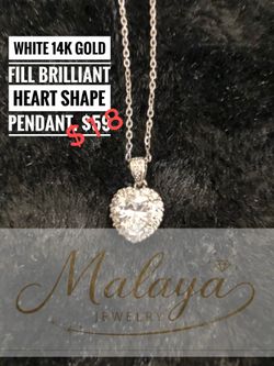 14k White Gold heart shape pendant with 18 inch necklace.