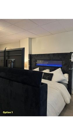 Upholstered Fireplace Bed features 10 color ambient lighting & motorized TV Lift