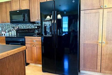 GE Black Side-by-Side Refrigerator with Water Dispenser
