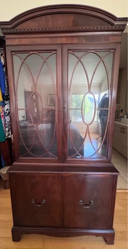 Federal Revival style china cabinet was manufactured by the Berkey & Gay Furniture Co. Age & Provenance