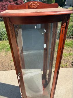 Display cabinet with light and mirror