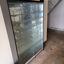 COMMERCIAL  LOCKABLE GLASS  DISPLAY  CASE - ON LOCKABLE ROLLERS