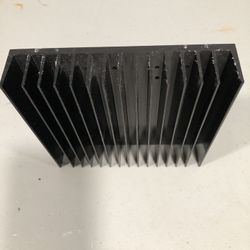 Large aluminum radiator with black cooling fins.