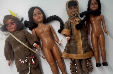 4 Native americans or eskimo dolls