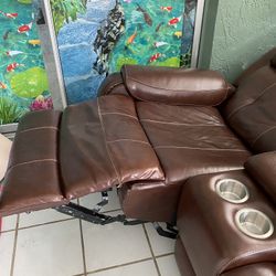 Leather Two Recliners Sofa Fully Opens.  All Electric Recliner. I Don’t Have Room . I Have To Sell. Color Is Maroon Red . Very Comfortable. Cup Holder