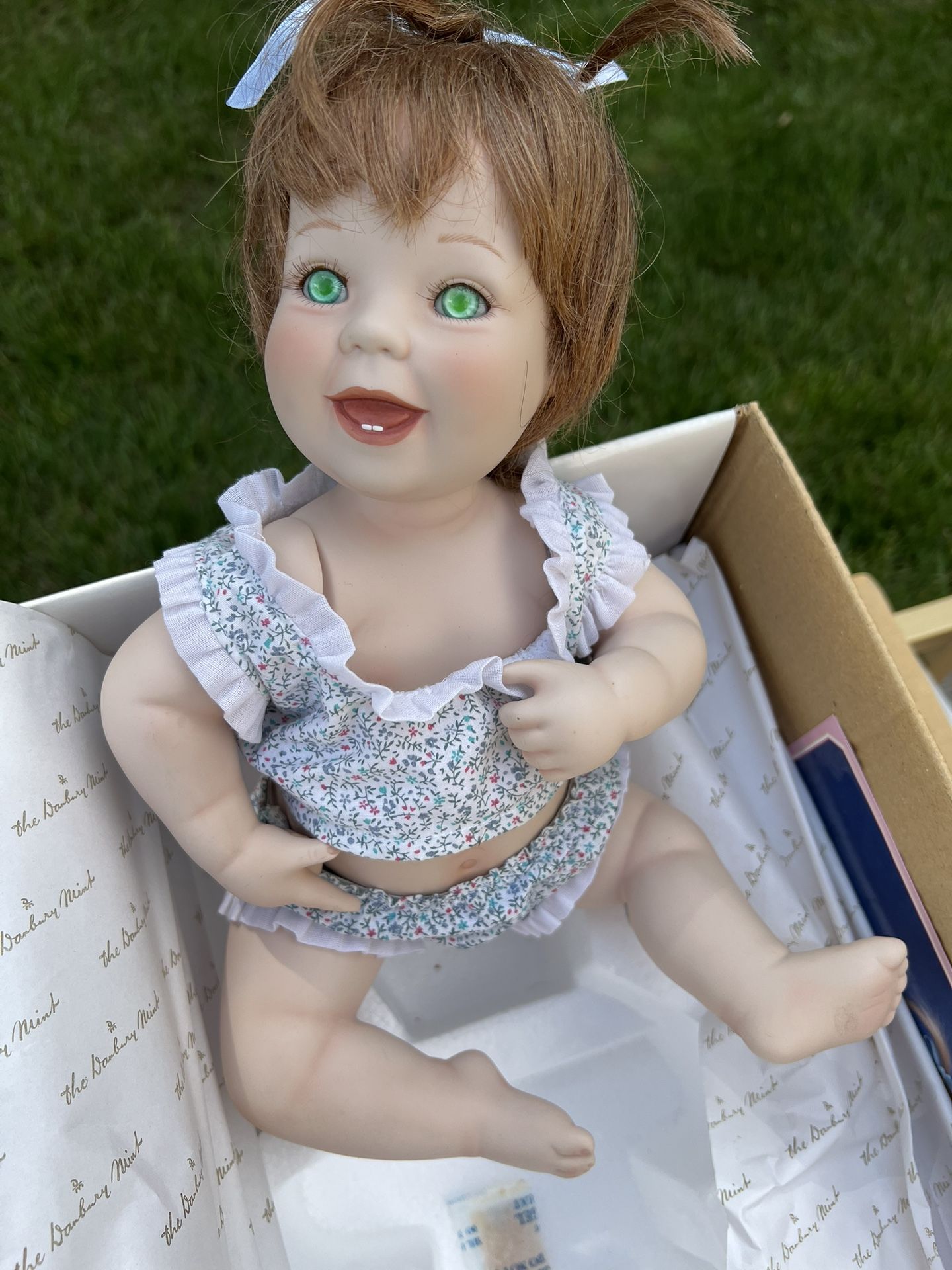Elke Hutchins Lil Punkin Porcelain Baby Doll Green Eyes Danbury mint 11x7x7 Measurements are approximate Preowned. Has been taken out of the box.