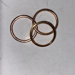 three gold ring bands