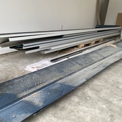 Assorted leftover black Metal Roofing Material 