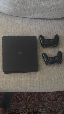 PlayStation 4 Slim Console with Two Controllers