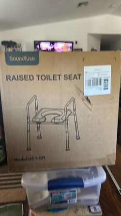 Raised toilet seat