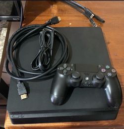 PS4 Slim console featuring a 1TB hard drive plus 14 games and webcam