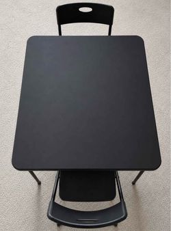 Black foldable table with 2 chairs