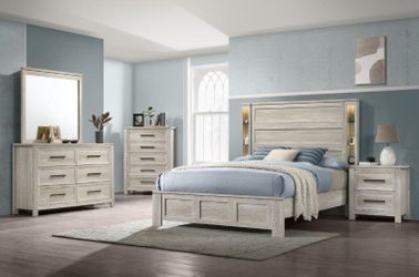 Elegant design bedroom set features built-in accent lighting and integrated storage