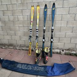 Snowboards And Skis With Boots And Bags 