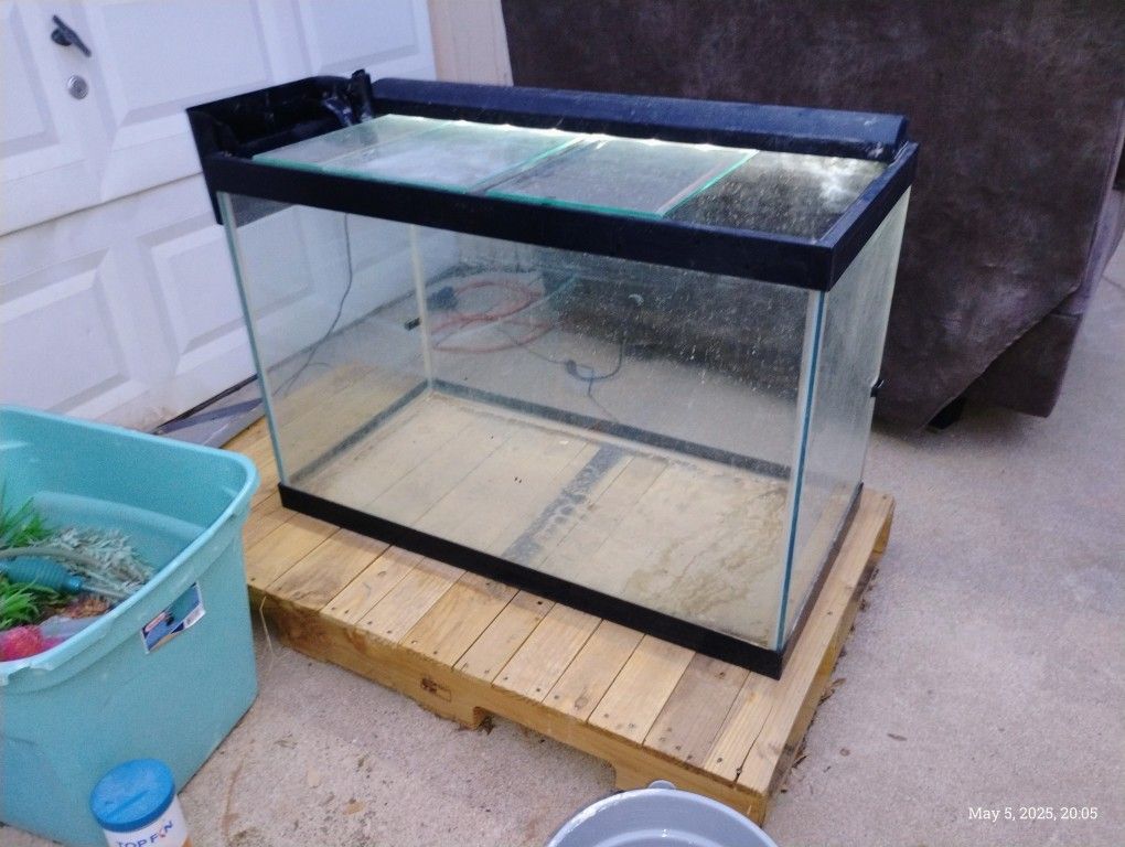 64 gallon Aquarium and Accessories No issue with the tank.
Pump works
Light works.
Comes with multiple plant and rock decorations., draining syphon, 2