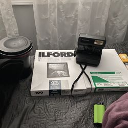 Vintage Polaroid Camera, Photo Paper, Film, And Camera Equipment