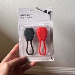 2PK compact silicone LED bicycle safety lights. Black And Red Beam Bugs